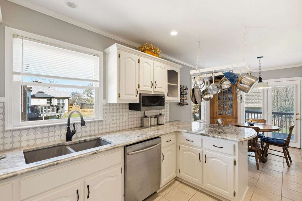 Another view of kitchen showing bar area.