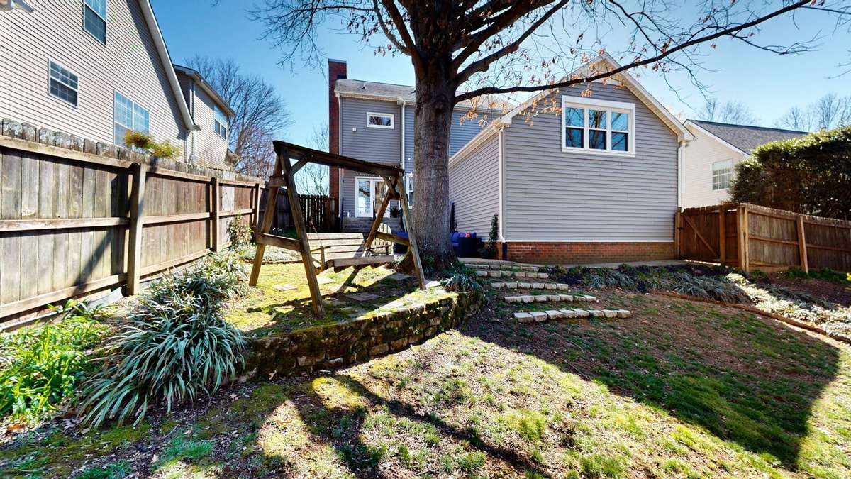 Park like backyard. Bench swing remains!