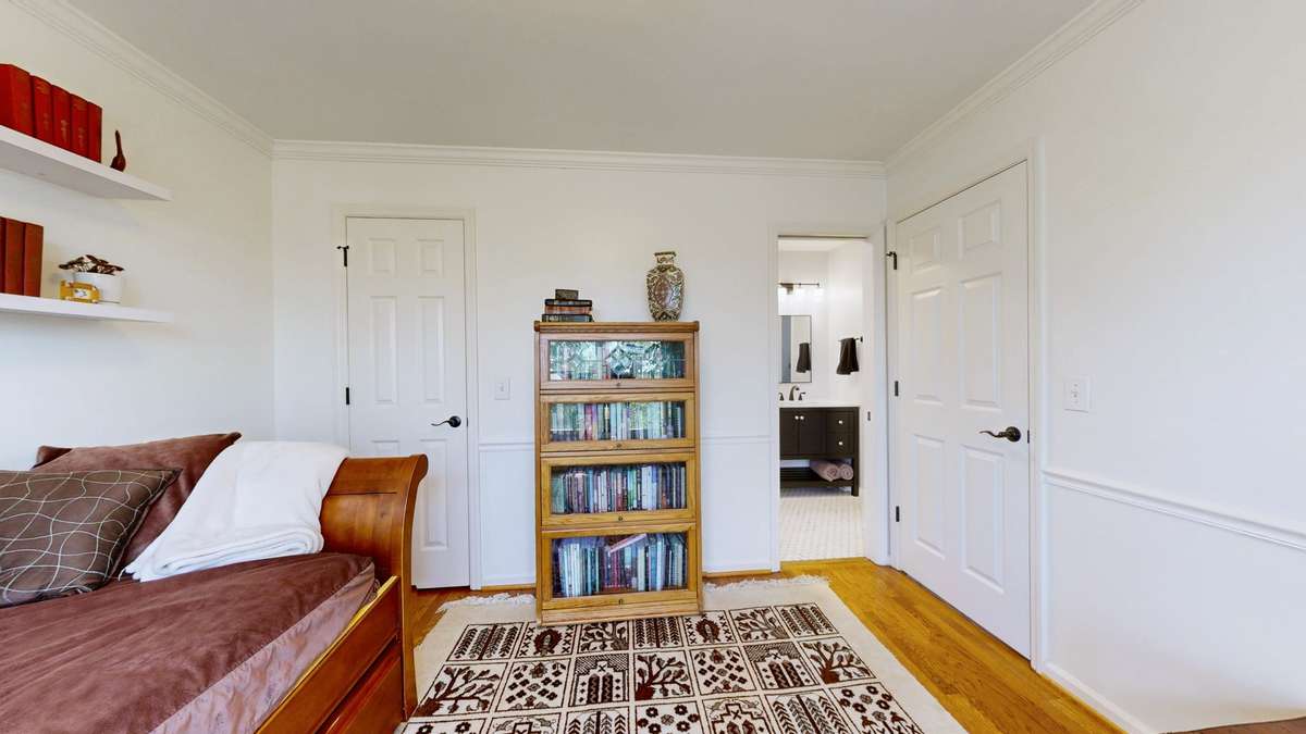 Walk in closet and pocket door adjoining the hall bath