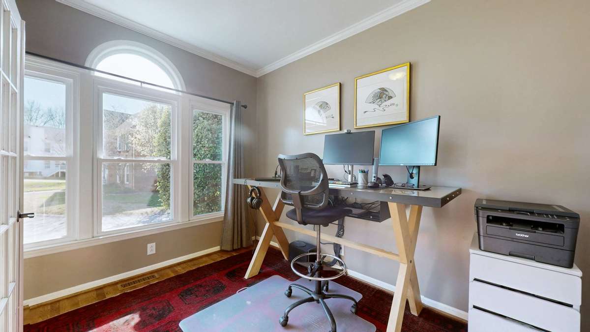 This office space had previously been a formal dining room. Seller converted it and added french doors. So much natural light!