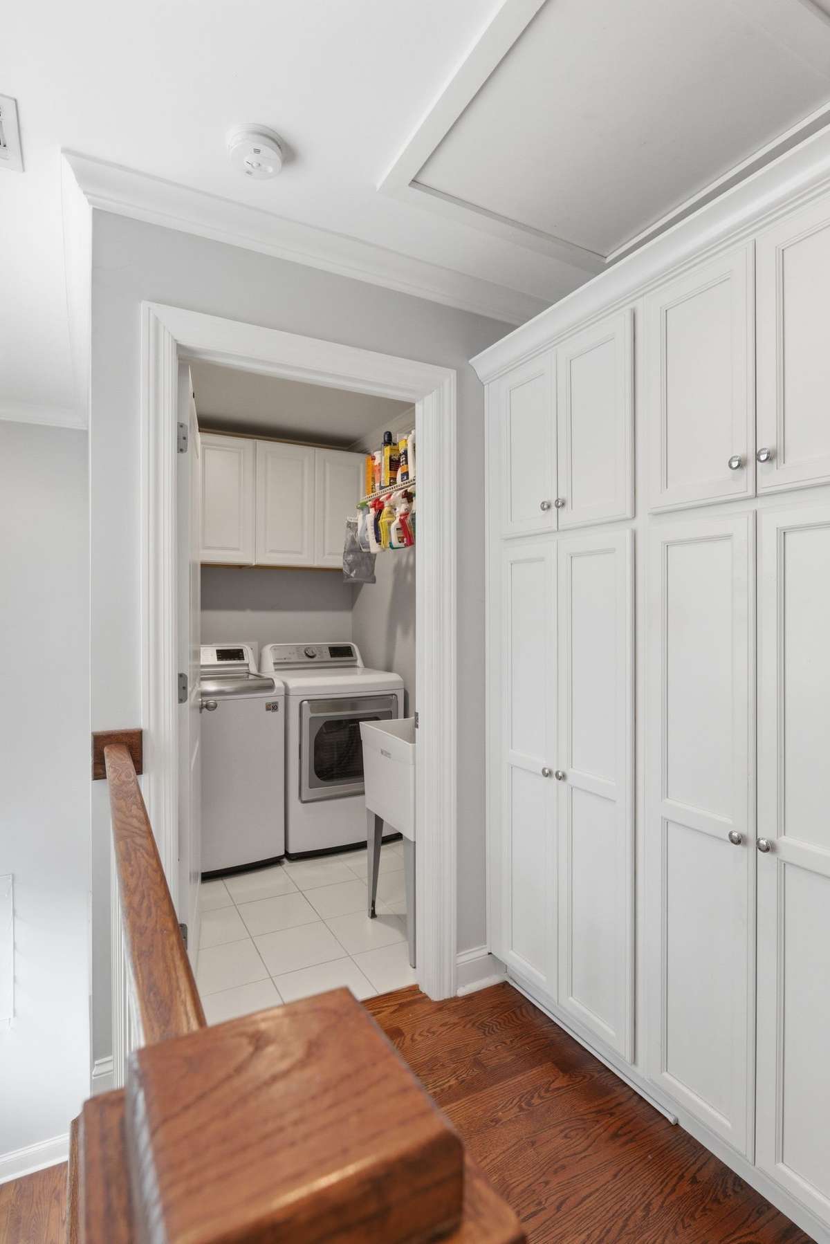 The back hallway (just off the kitchen) offers pantry storage and leads to the laundry room