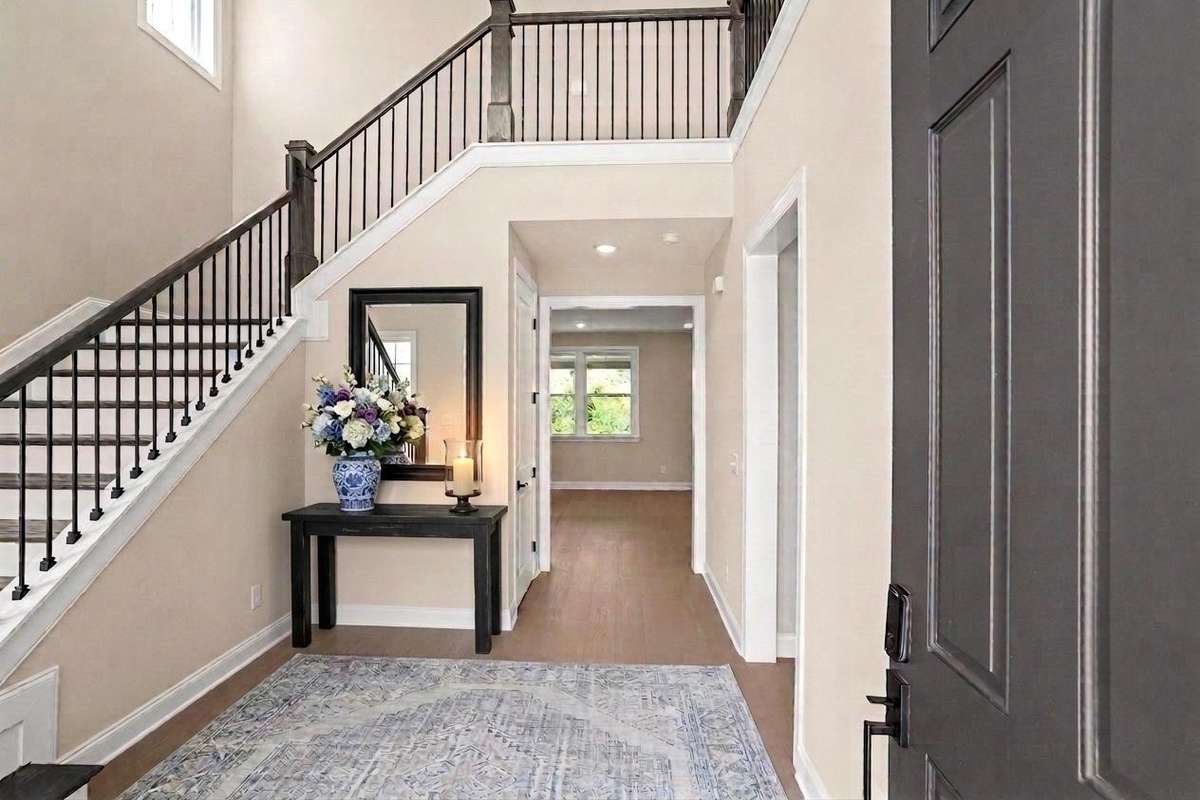 AI Staged view of the foyer when you enter the home.