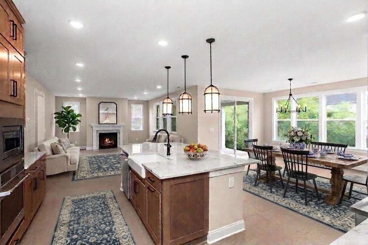 AI Staged view of the kitchen looking into the dining area and family room