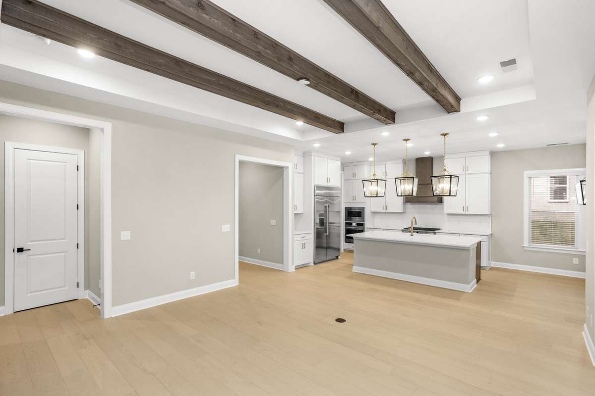 Another view of the family room, into the kitchen, with the hall to the master bedroom to the left