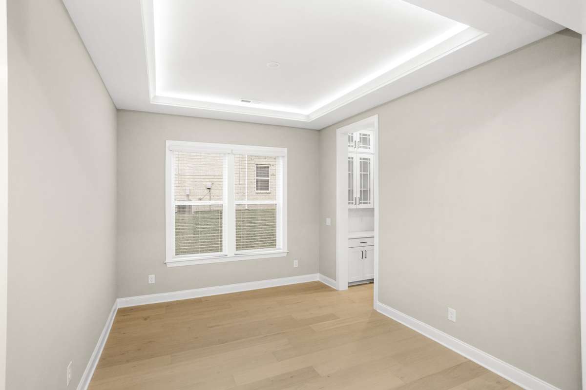 Dining Room and a peek into the butler's pantry with a large walk in pantry