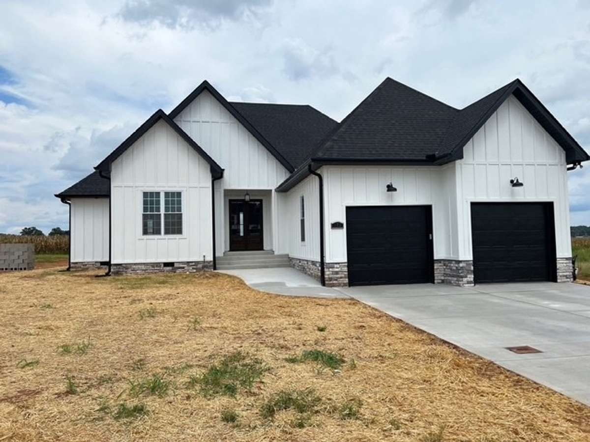 Photo is an example of same house built in another location. Colors and design may change.