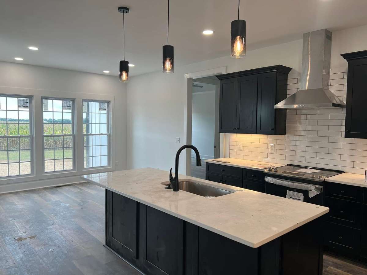 Photo is an example of same house built in another location. Colors and design may change