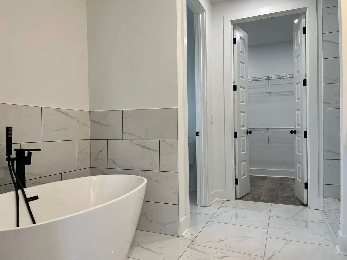 Photo is an example of same house built in another location. Colors and design may change