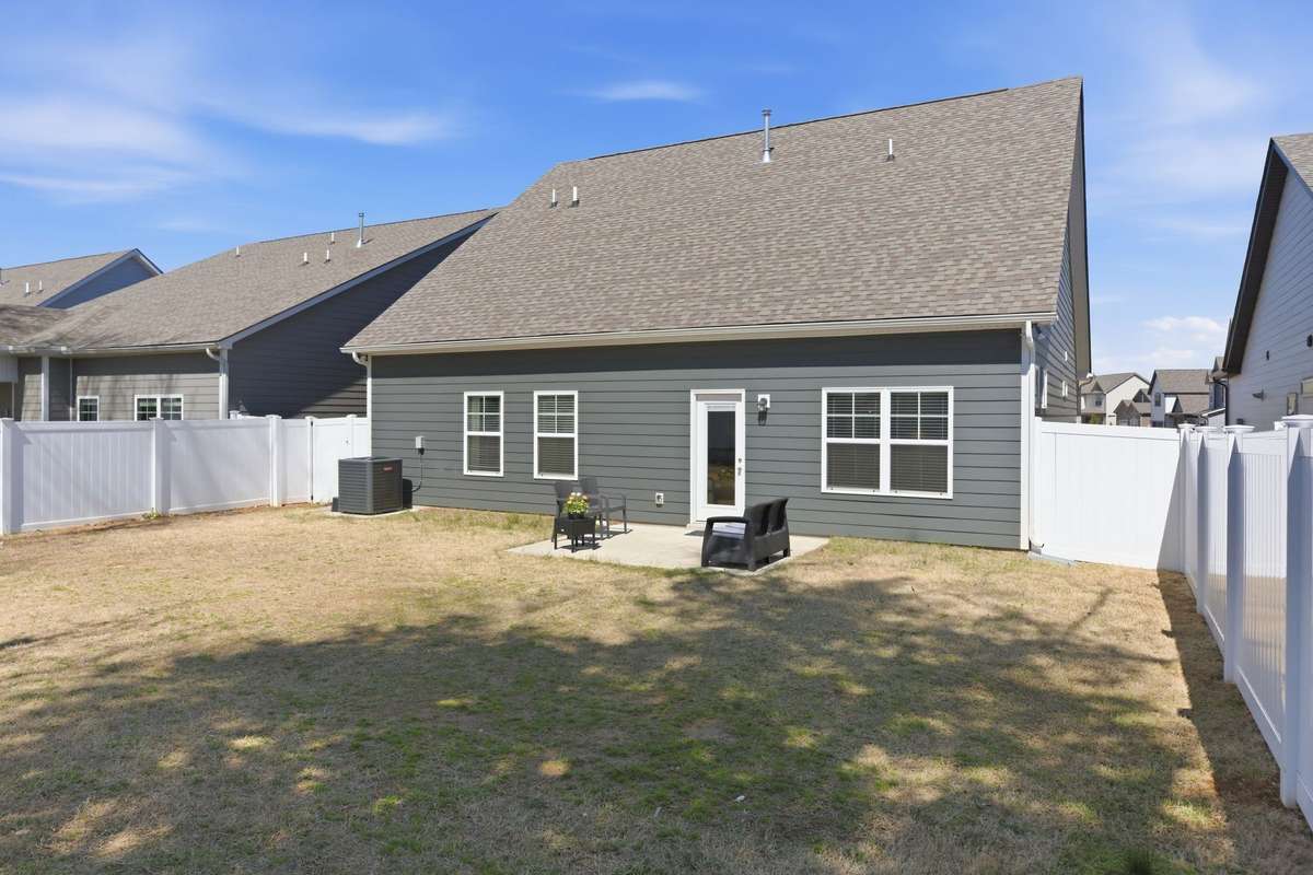 Enjoy outdoor living in this fully fenced backyard, offering privacy and plenty of space for relaxing, entertaining, or pets to play. The patio area provides the perfect spot for outdoor seating or grilling, with a level yard.