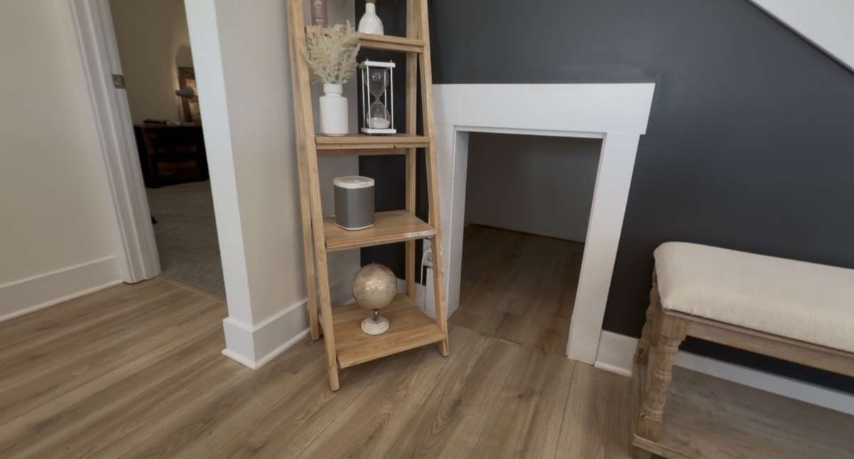 Charming built-in dog nook tucked beneath the stairs, offering a cozy and functional space for your furry friend while maximizing every inch of the home. A unique and thoughtful feature that adds both character and convenience.
