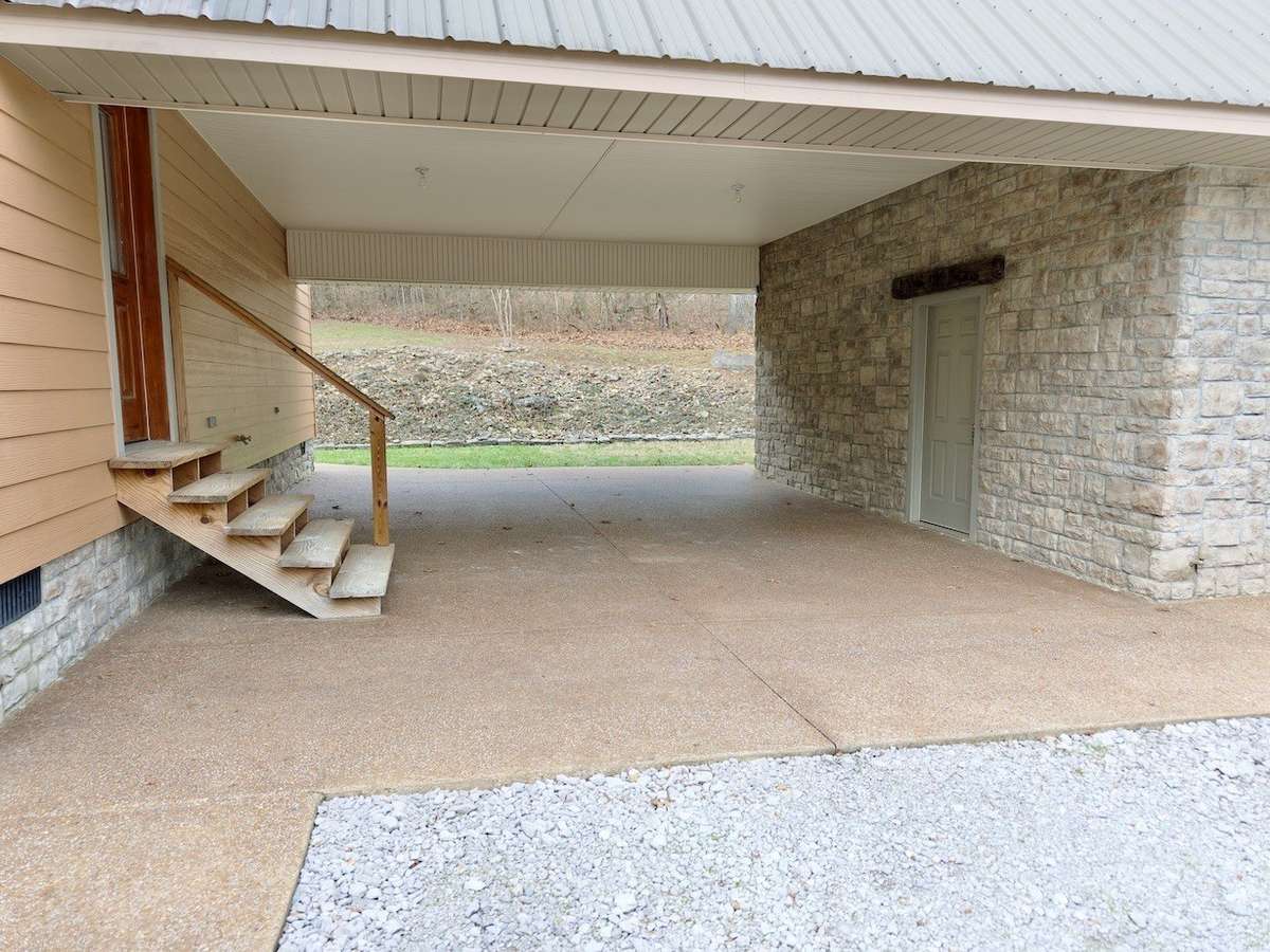 Carport area and entrance to storage and safe room on right.  Storage and safe room are climate controlled.