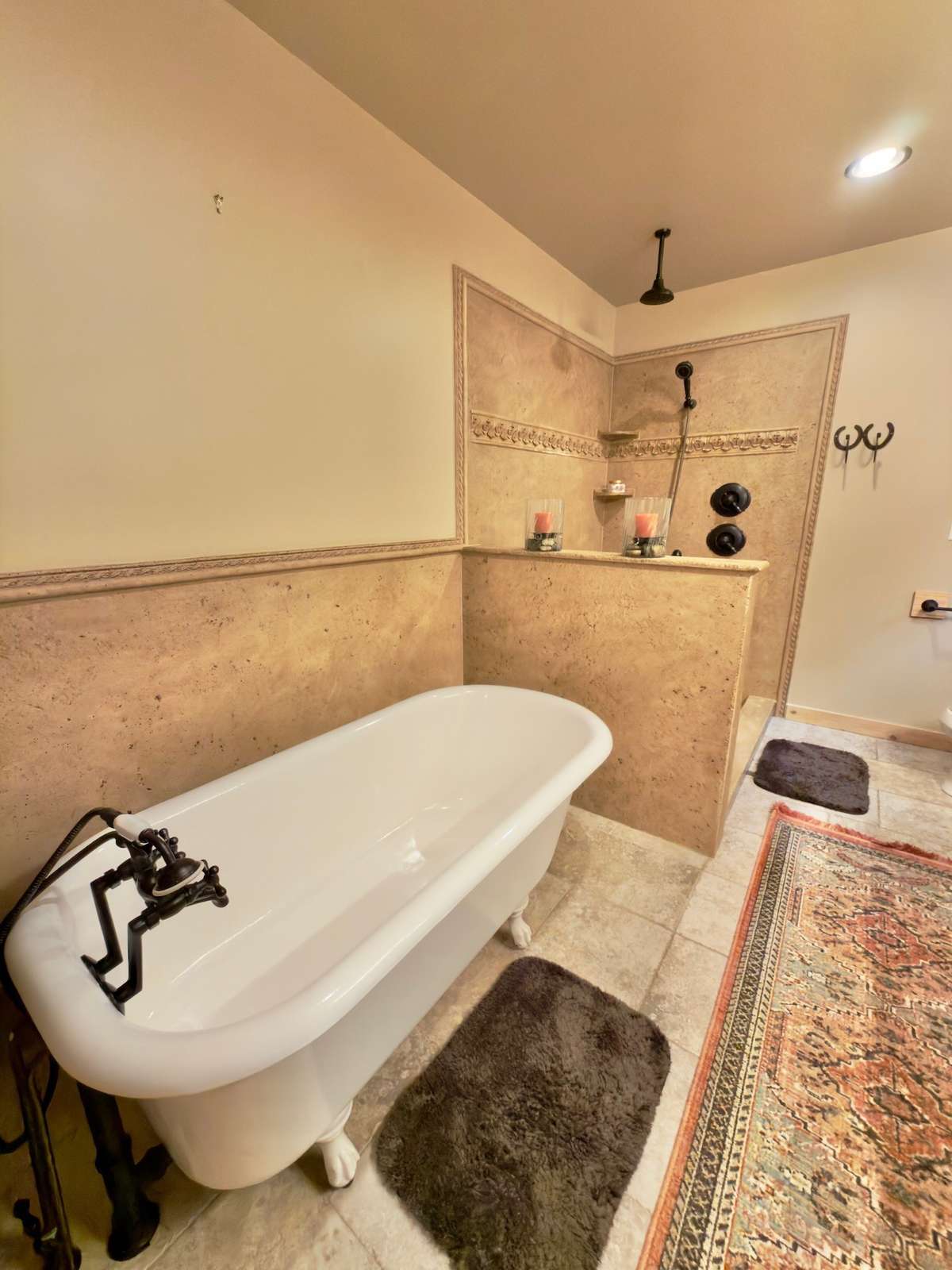 Primary bath features claw foot tub and separate walk-in shower.
