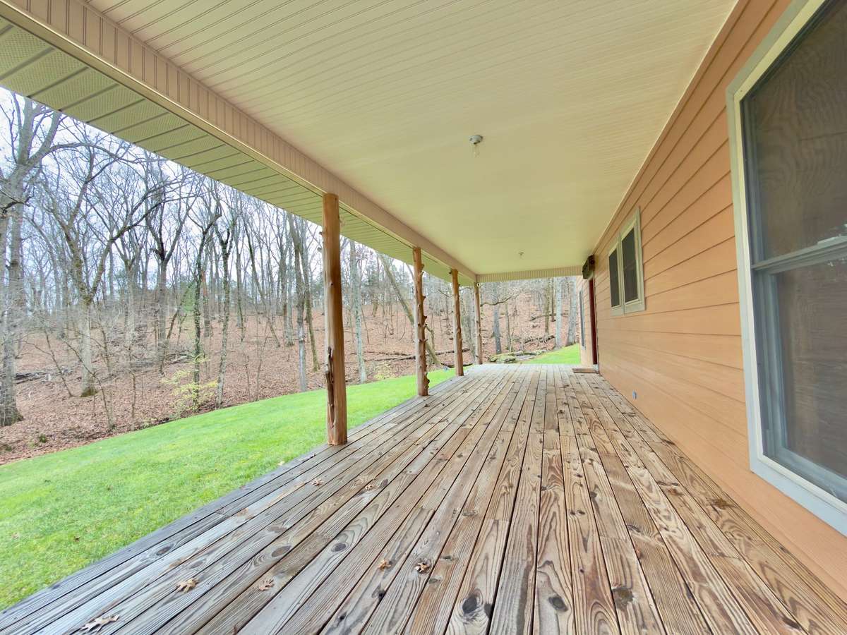 Spacious covered front porch for watching the wildlife walk by.