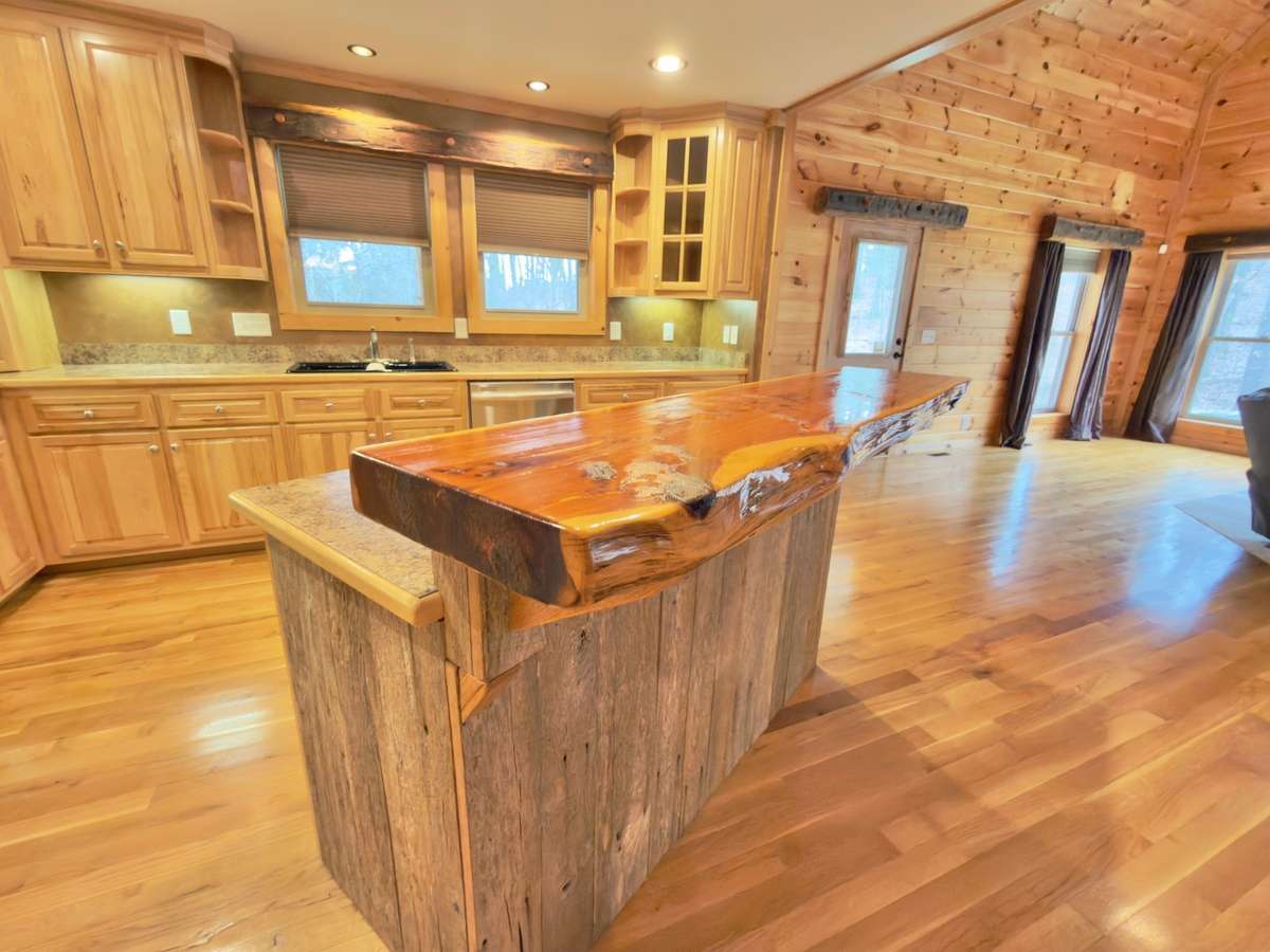 Notice the large cedar slab bar on the island.