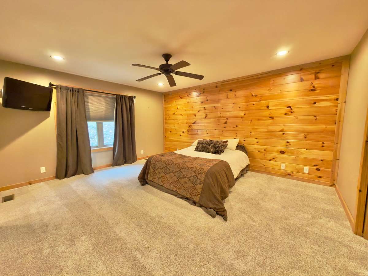 Spacious primary bedroom measures approximately 17x16 with walk-in closet and primary bath with separate shower and claw foot tub.