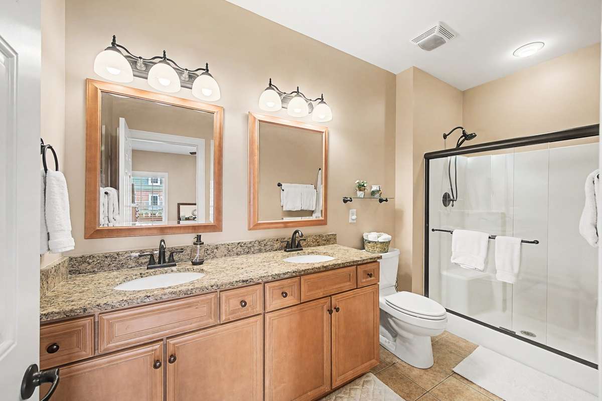 Owner's Bathroom features dual vanities, decorator mirrors, large oversized walk-in shower with bench.  Entire home is upgraded with Oil Rubbed Bronze fixtures and hardware