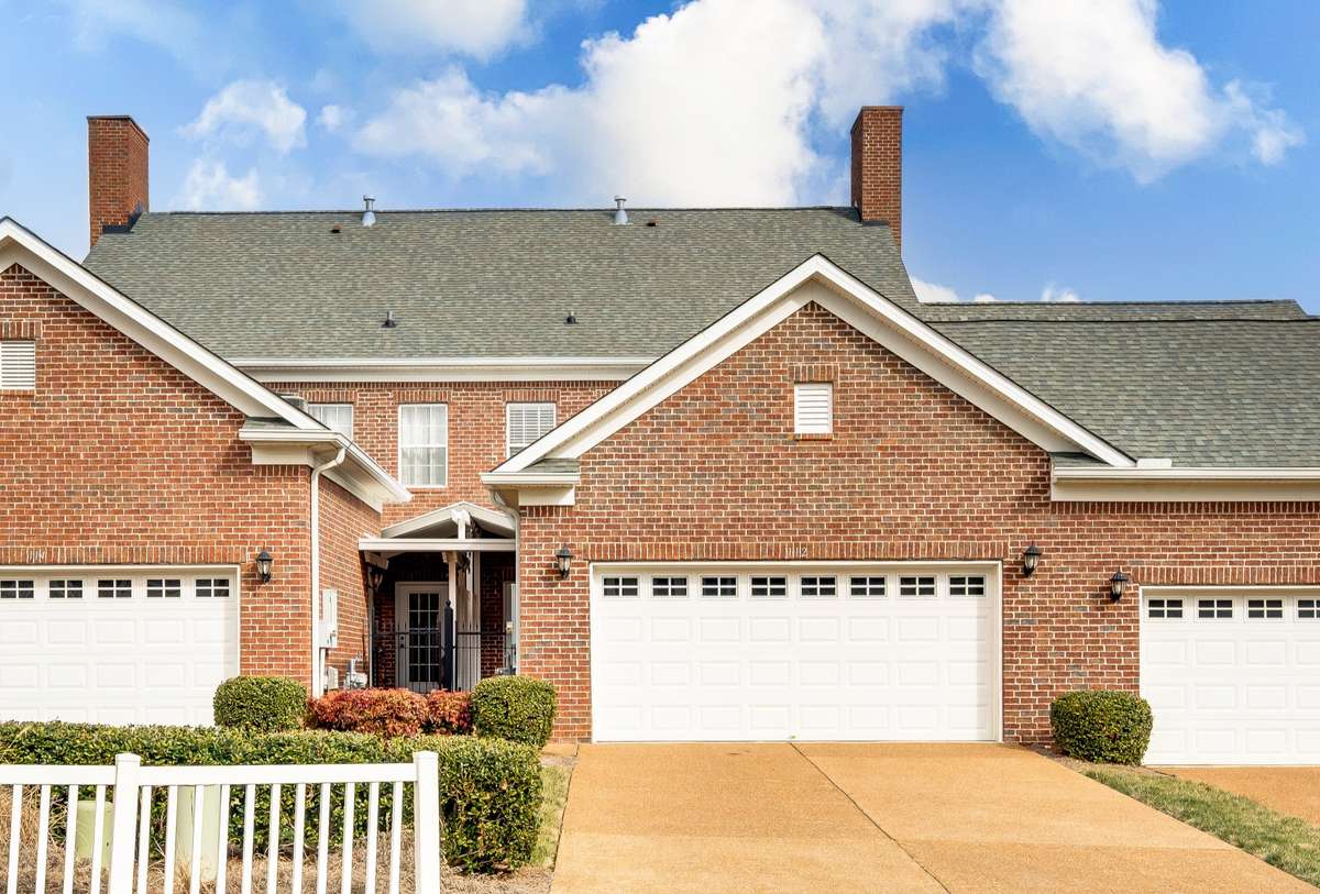 Rear entrance for convenient access.  This townhome enjoys a longer driveway for plenty of additional parking in addition to the nearby visitor parking