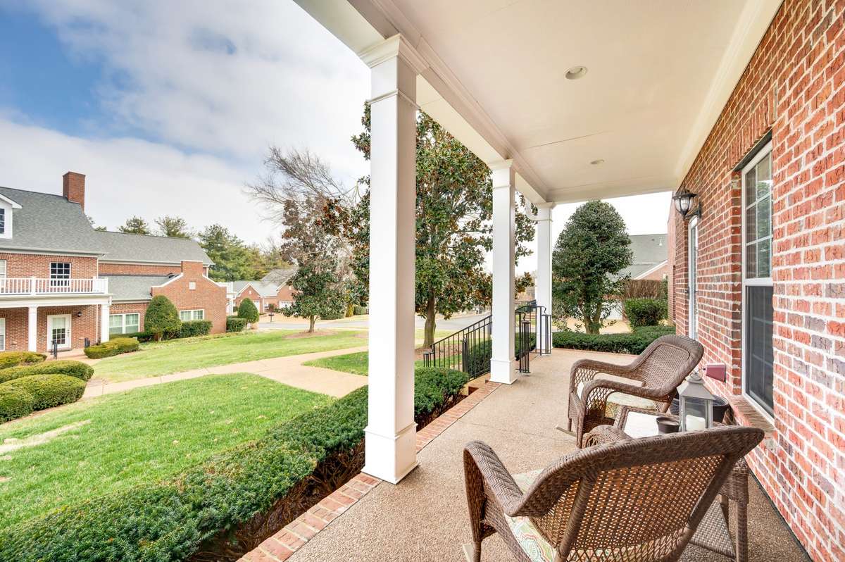 Enjoy the peaceful setting with manicured landscaping and a comfortable front covered porch, ideal for gathering with friends or unwinding at the end of the day.
