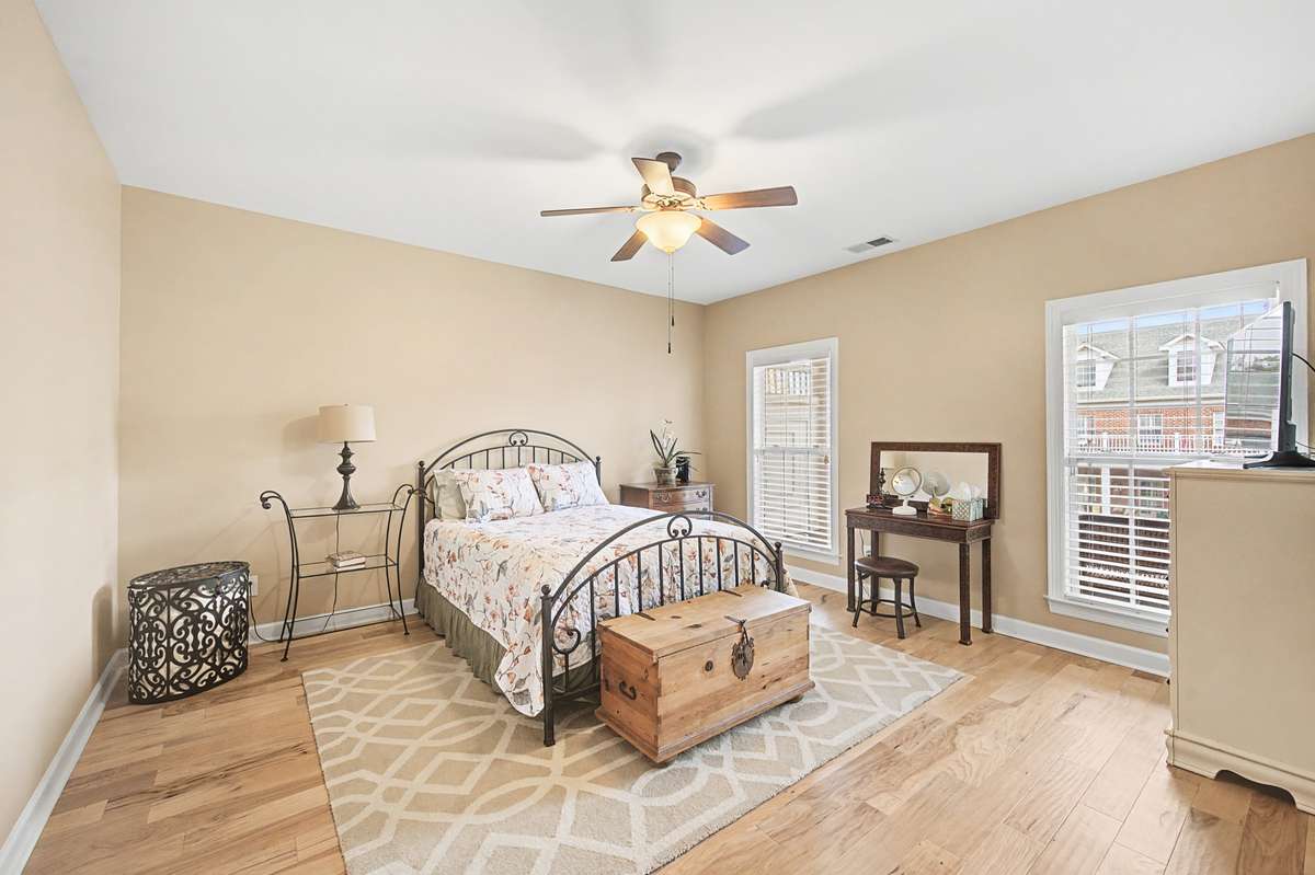 Downstairs Owne's Suite enjoys a view of the beautiful landspaced courtyard.  Fresh neutral paint is throughout the entire home.