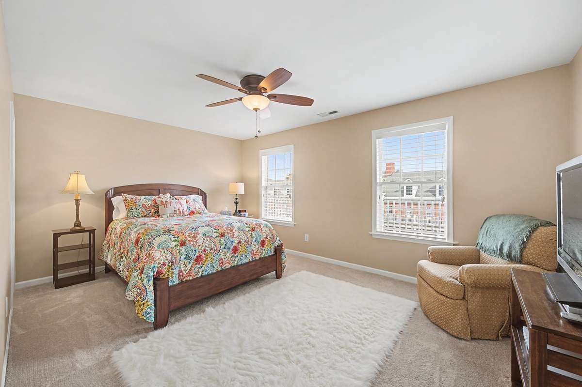 Bedroom #2 features a ceiling light/fixture (found in all bedrooms), large closet and a view of the courtyard
