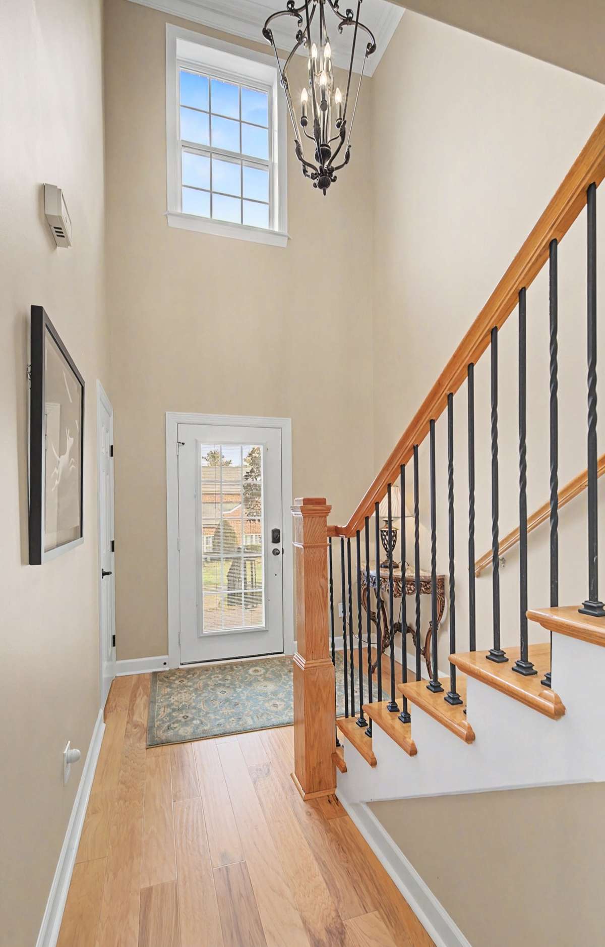 2-Story Grand Foyer with gorgeous chandelier makes a statement when your guests step through the front door