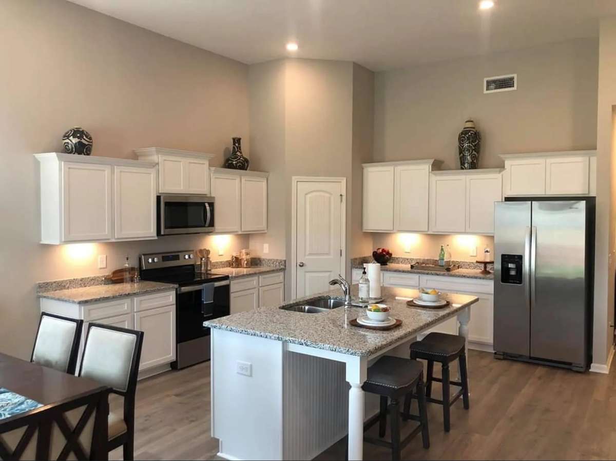 Stock Photo: Home features a large Kitchen Island, Corner Pantry and all Stainless Steel Kitchen Appliances!