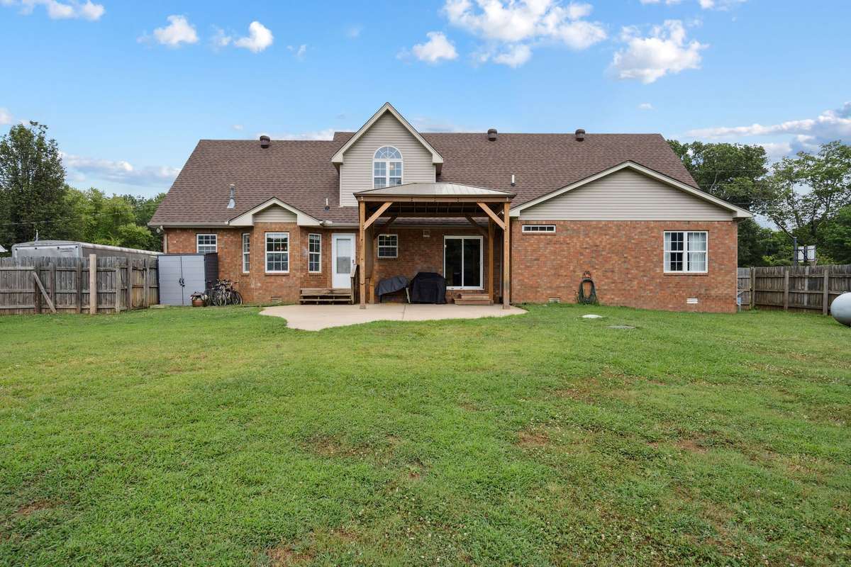 Stunning backyard 4 bedroom, 3 and a half bathroom in Murfreesboro Tennessee with over half an acre of land and no HOA, a two car garage and updated kitchen.