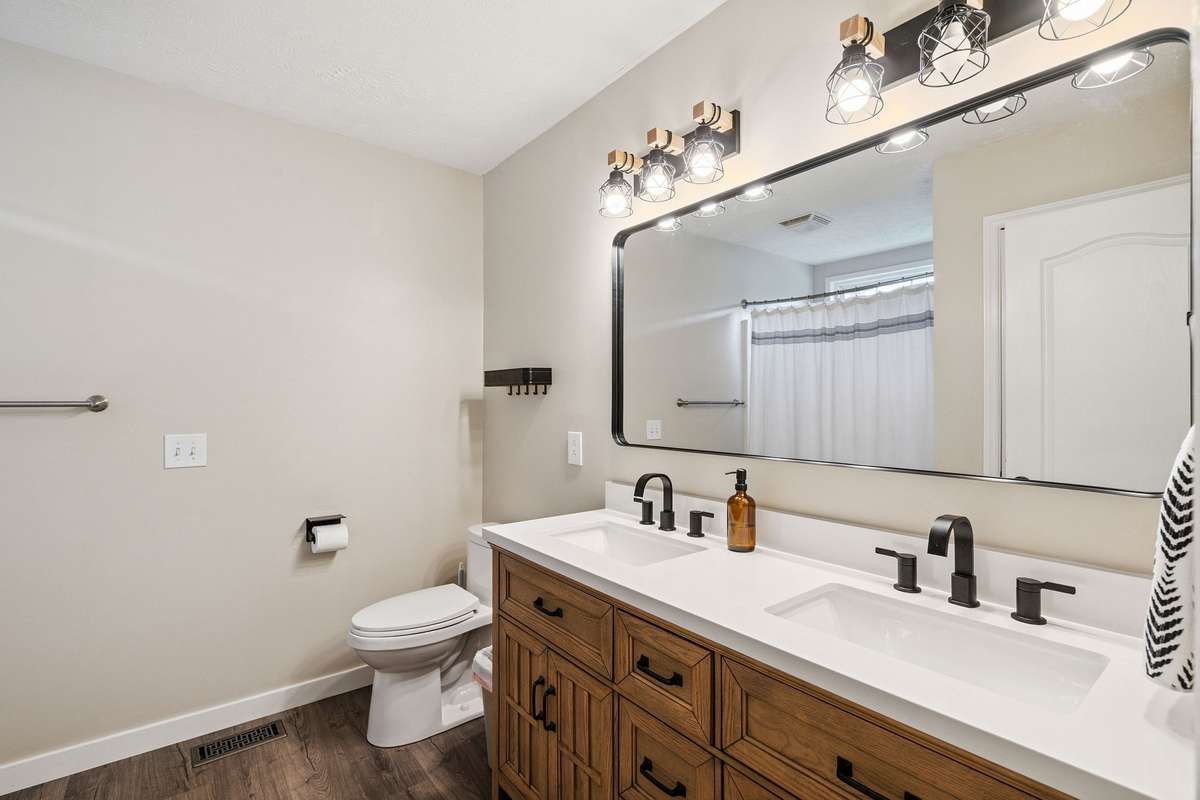 Beautiful primary bathroom in this 4 bedroom, 3 and a half bathroom in Murfreesboro Tennessee with over half an acre of land and no HOA, a two car garage and updated kitchen.