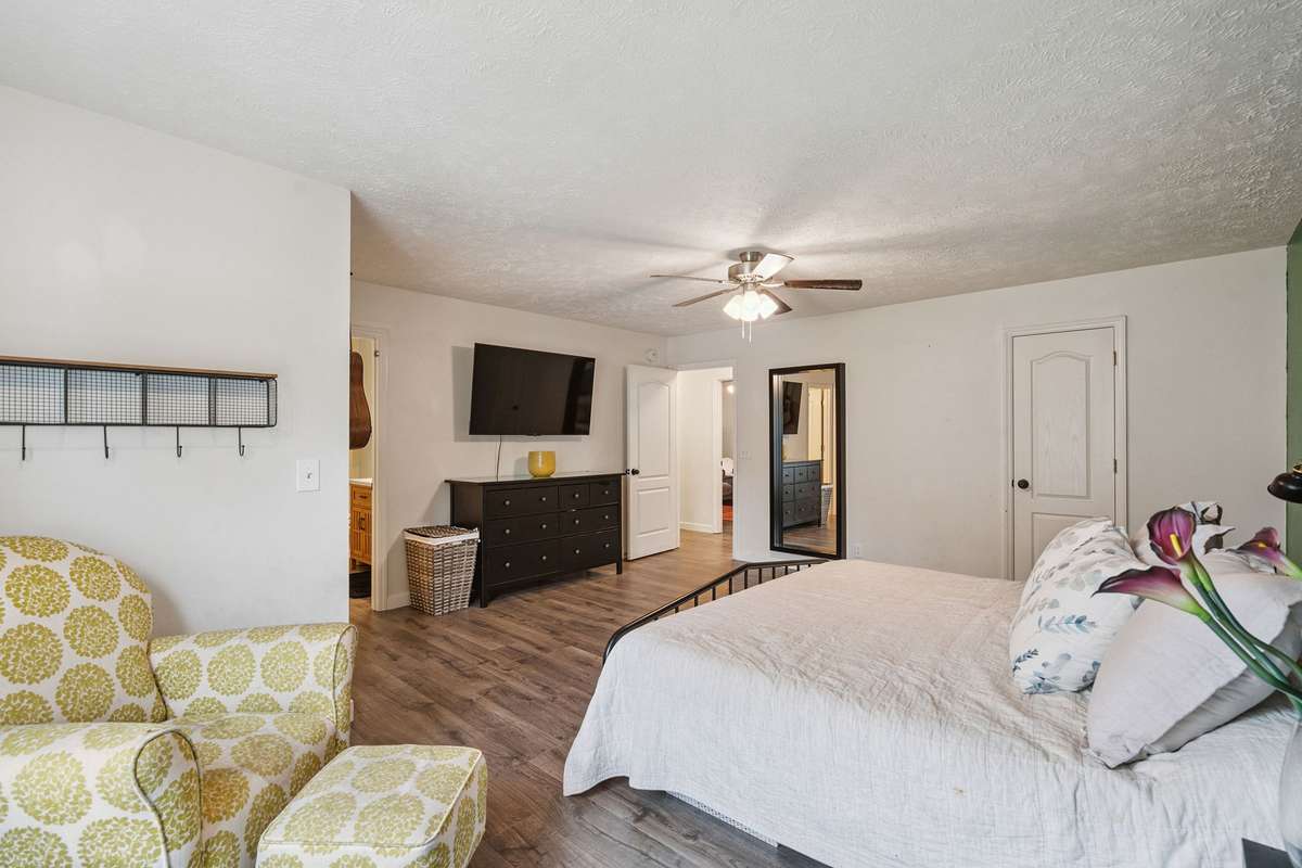 Beautiful primary bedroom in this 4 bedroom, 3 and a half bathroom in Murfreesboro Tennessee with over half an acre of land and no HOA, a two car garage and updated kitchen.