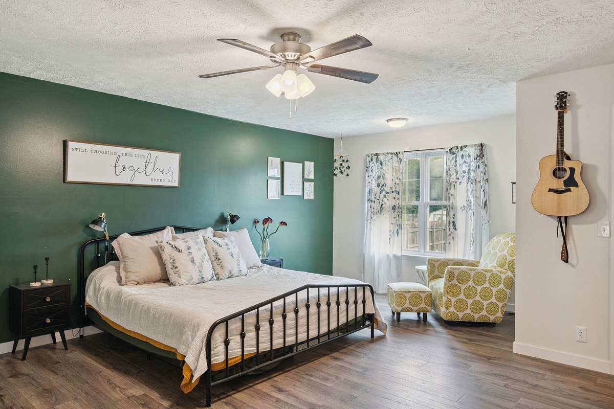 Beautiful primary bedroom in this 4 bedroom, 3 and a half bathroom in Murfreesboro Tennessee with over half an acre of land and no HOA, a two car garage and updated kitchen.