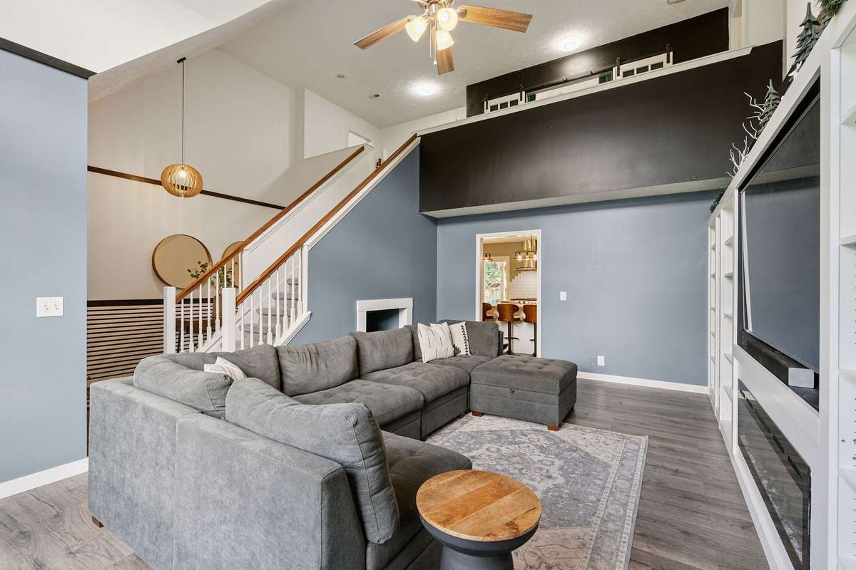 Beautiful living room in this 4 bedroom, 3 and a half bathroom in Murfreesboro Tennessee with over half an acre of land and no HOA, a two car garage and updated kitchen.