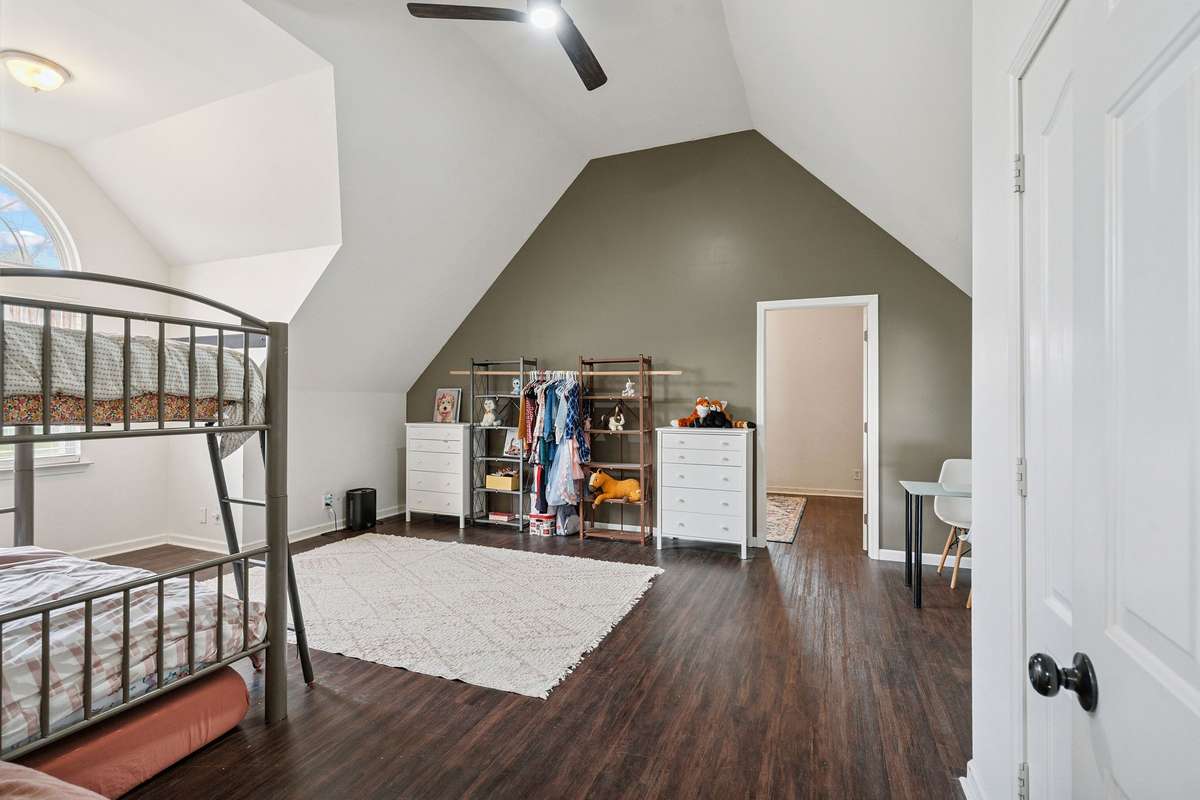 Upstairs bonus room in this 4 bedroom, 3 and a half bathroom in Murfreesboro Tennessee with over half an acre of land and no HOA, a two car garage and updated kitchen.