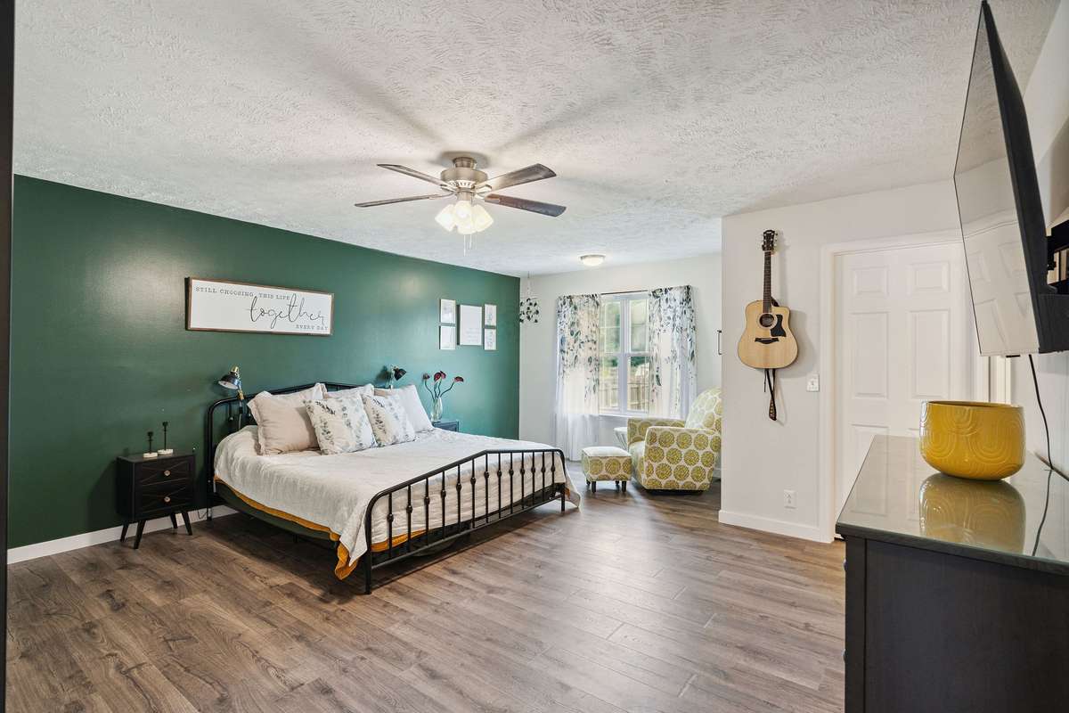 Beautiful primary bedroom in this 4 bedroom, 3 and a half bathroom in Murfreesboro Tennessee with over half an acre of land and no HOA, a two car garage and updated kitchen.
