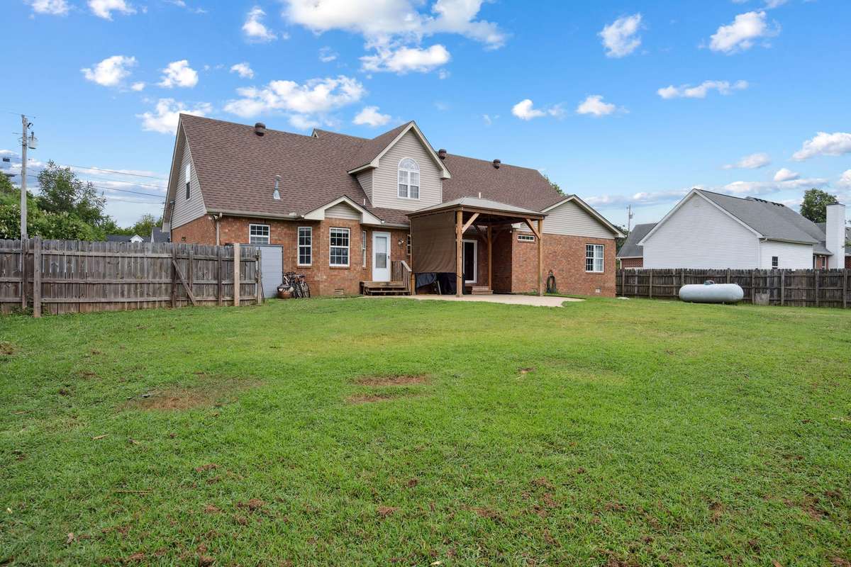 Stunning backyard 4 bedroom, 3 and a half bathroom in Murfreesboro Tennessee with over half an acre of land and no HOA, a two car garage and updated kitchen.