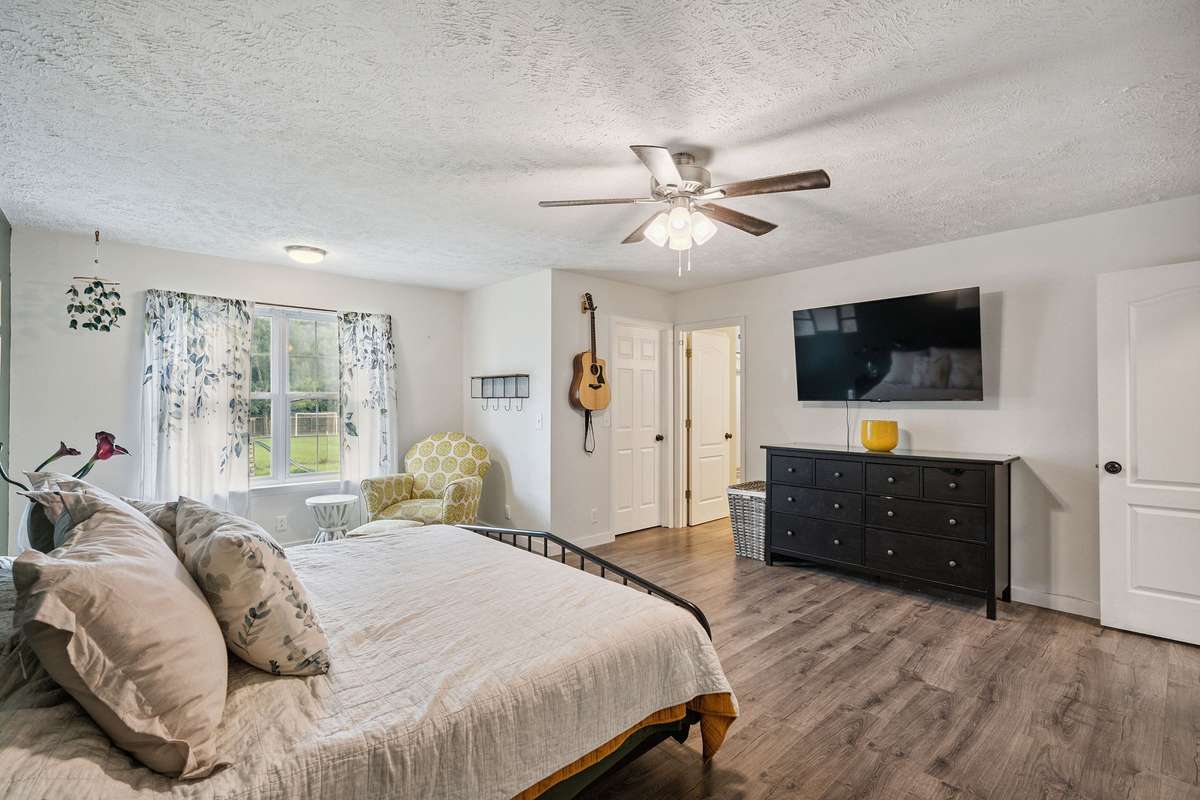 Beautiful primary bedroom in this 4 bedroom, 3 and a half bathroom in Murfreesboro Tennessee with over half an acre of land and no HOA, a two car garage and updated kitchen.