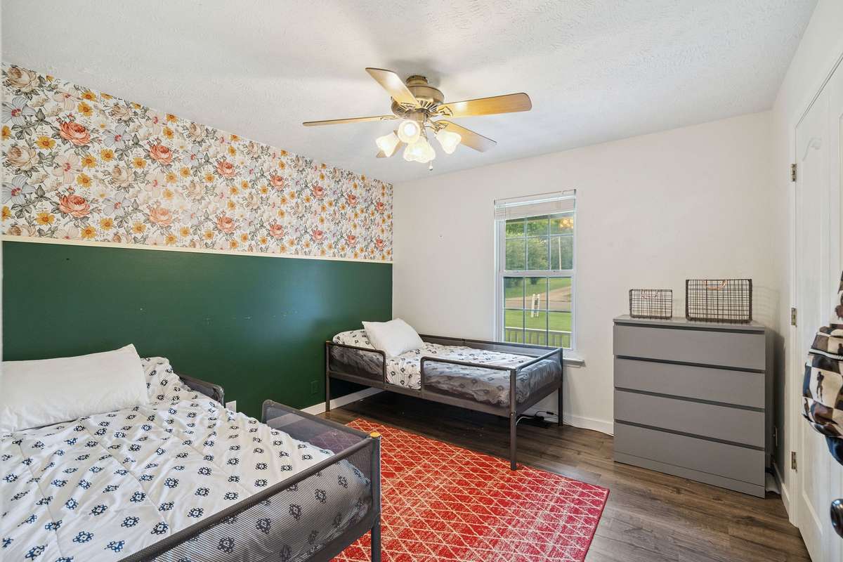 One of the 3 downstairs bedrooms in this 4 bedroom, 3 and a half bathroom in Murfreesboro Tennessee with over half an acre of land and no HOA, a two car garage and updated kitchen.