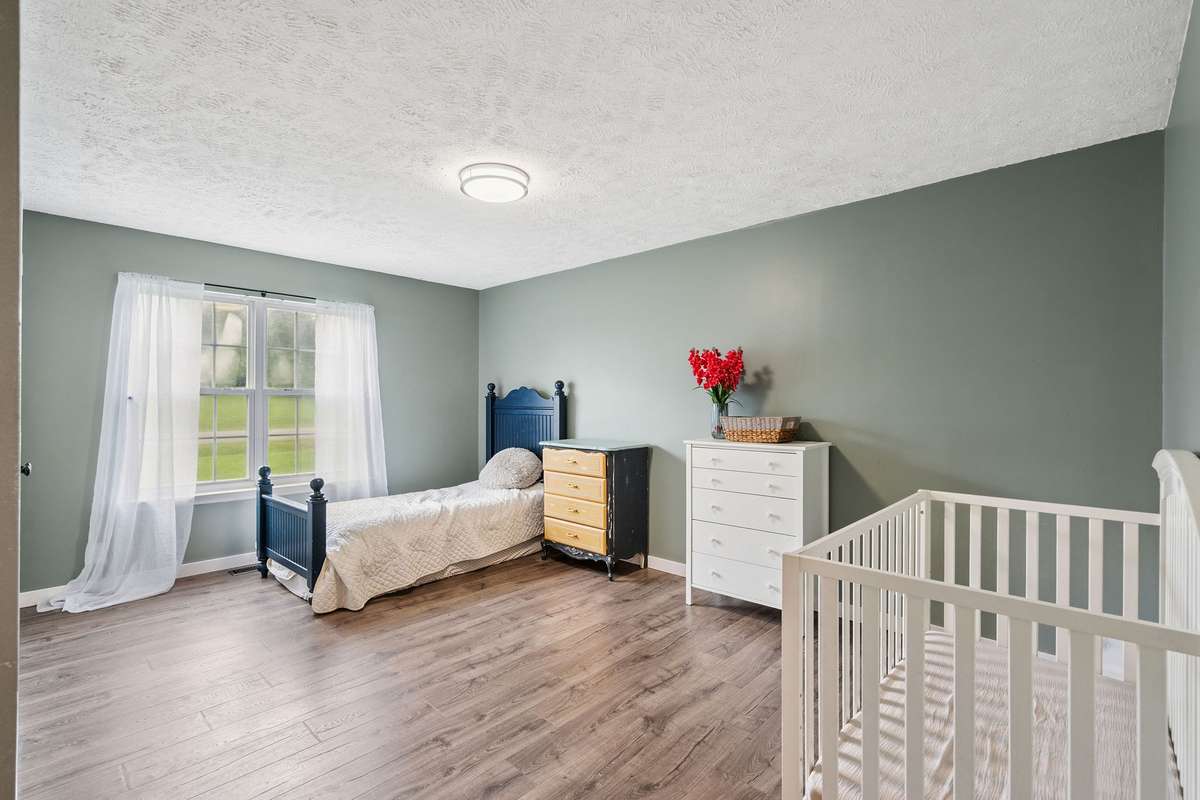 One of the 3 downstairs bedrooms in this 4 bedroom, 3 and a half bathroom in Murfreesboro Tennessee with over half an acre of land and no HOA, a two car garage and updated kitchen.
