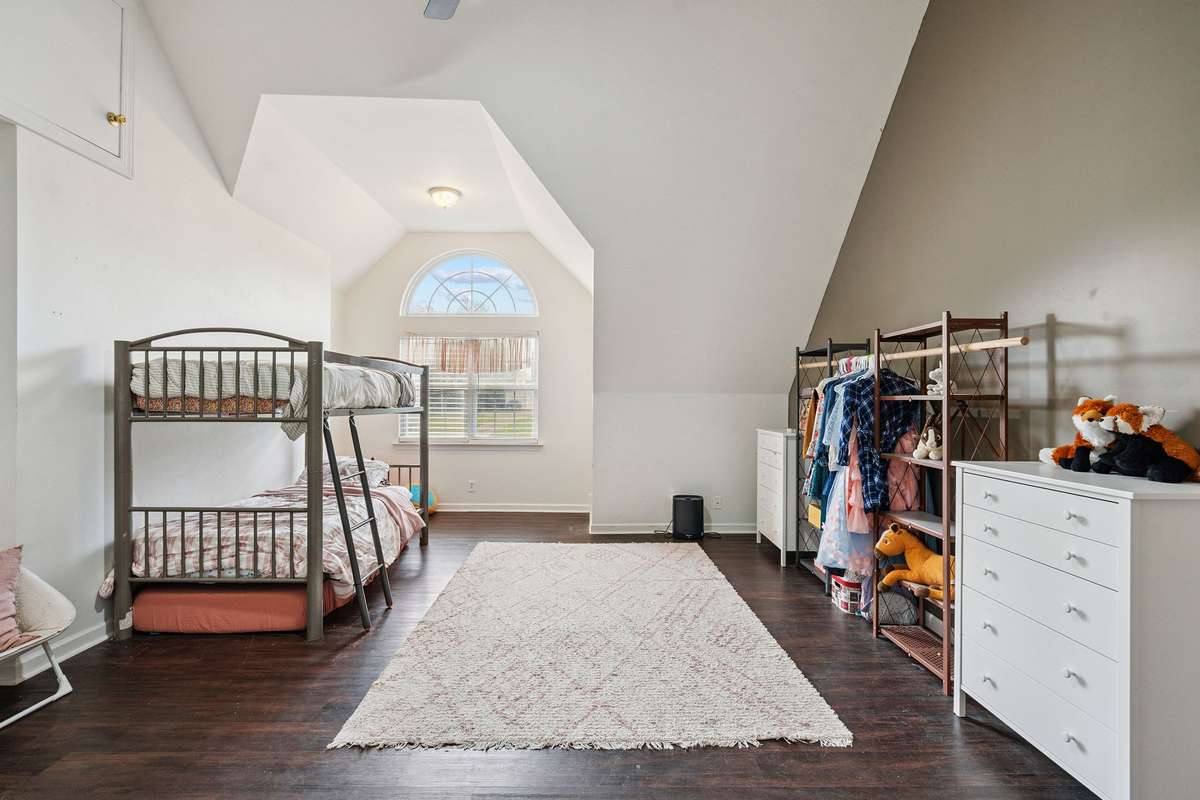 Upstairs bonus room in this 4 bedroom, 3 and a half bathroom in Murfreesboro Tennessee with over half an acre of land and no HOA, a two car garage and updated kitchen.