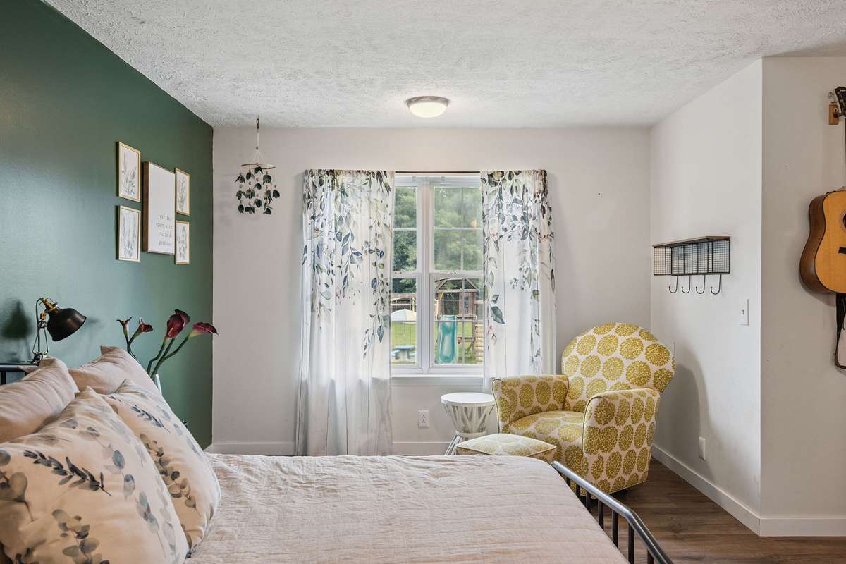 Beautiful primary bedroom in this 4 bedroom, 3 and a half bathroom in Murfreesboro Tennessee with over half an acre of land and no HOA, a two car garage and updated kitchen.