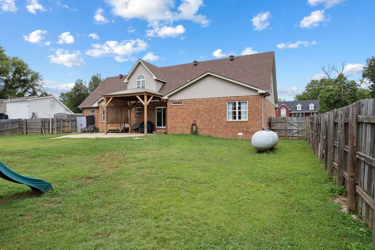 Stunning backyard 4 bedroom, 3 and a half bathroom in Murfreesboro Tennessee with over half an acre of land and no HOA, a two car garage and updated kitchen.
