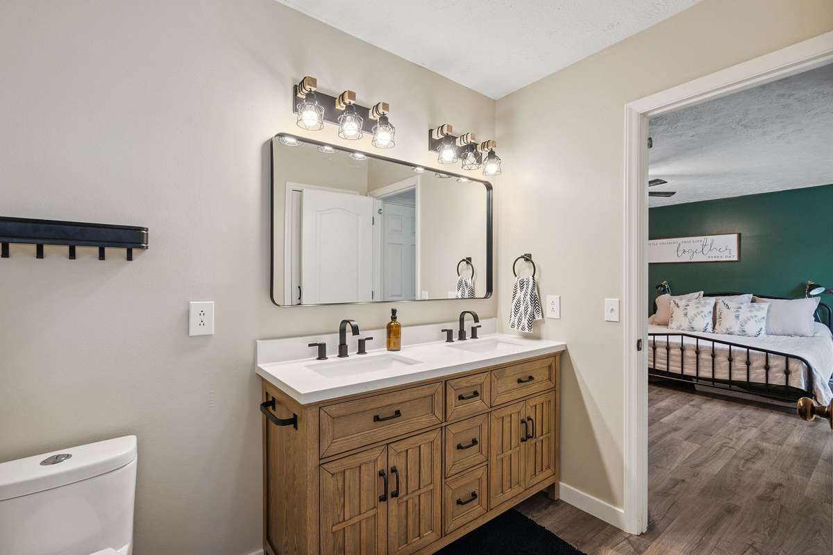 Beautiful primary bathroom in this 4 bedroom, 3 and a half bathroom in Murfreesboro Tennessee with over half an acre of land and no HOA, a two car garage and updated kitchen.