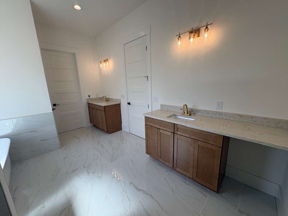 Primary bath with split vanities