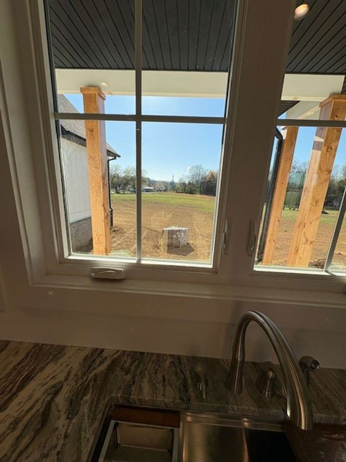 This is the serving window from kitchen onto covered back porch! Look at that country view