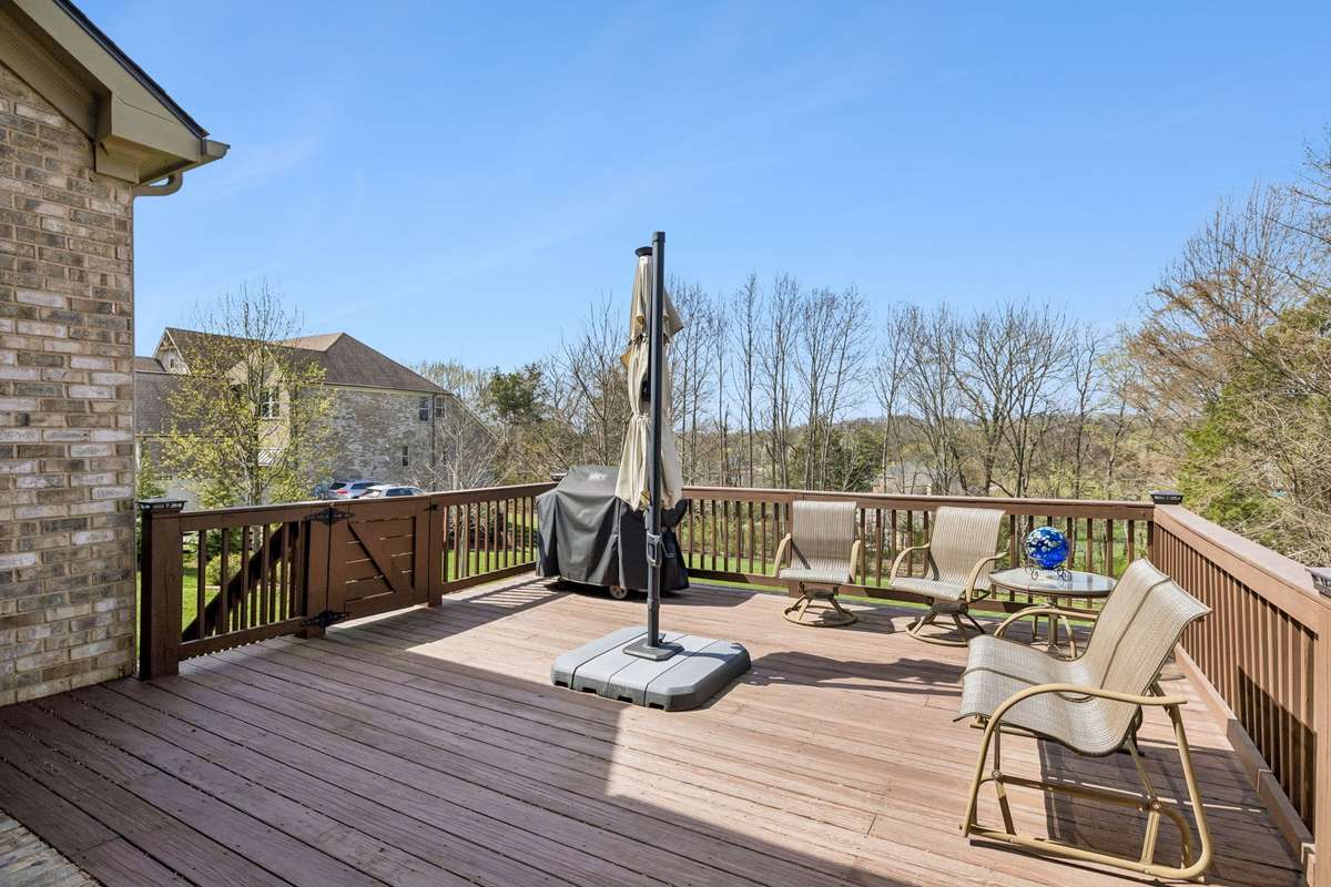 The covered patio opens to the oversized deck.