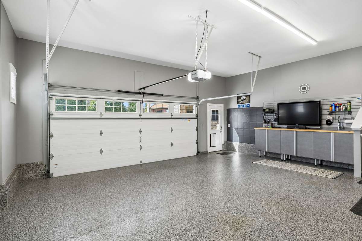 Both the single and the double bay garage have updated wood carriage house overhead doors that are insulated.