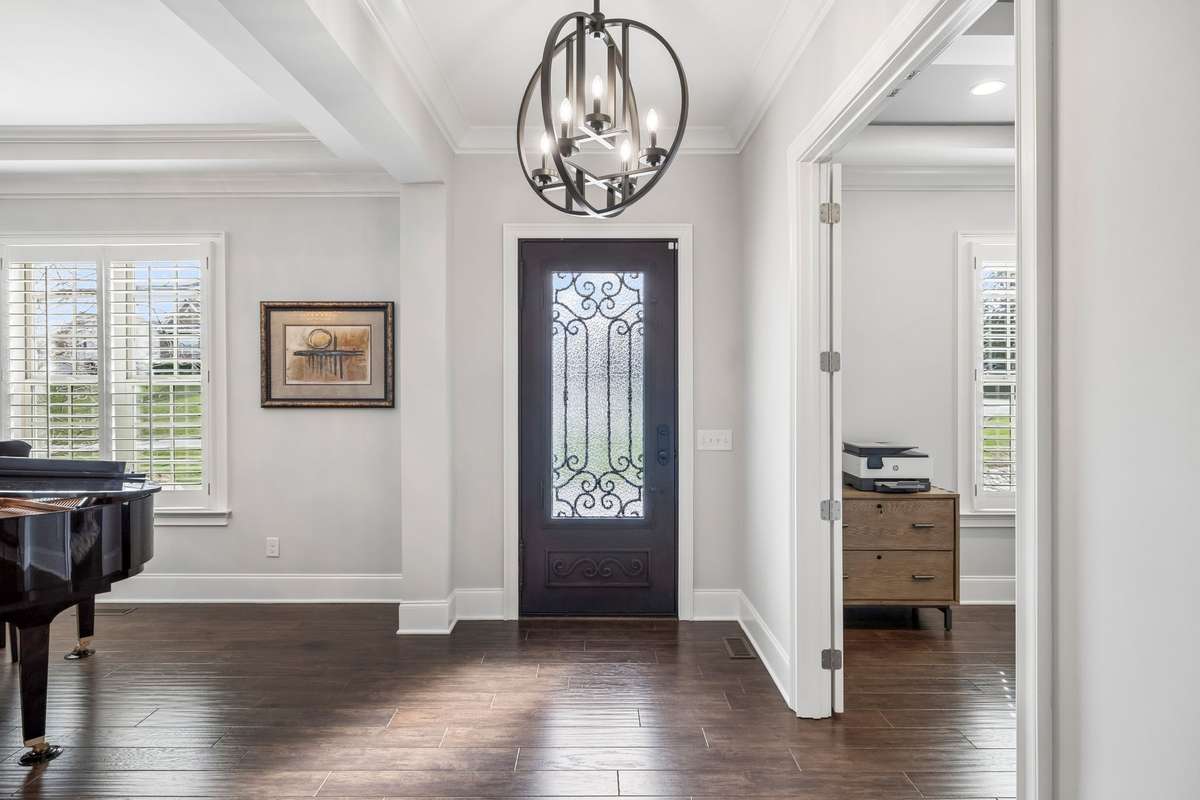 Beautiful custom plantation shutters are placed on the windows on the front of the home.