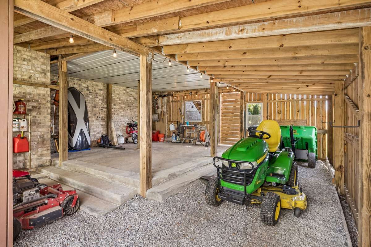 This incredible storage area can house all the lawn equipment. It stays dry so that everything stored is fully protected. Party lights have even been installed!