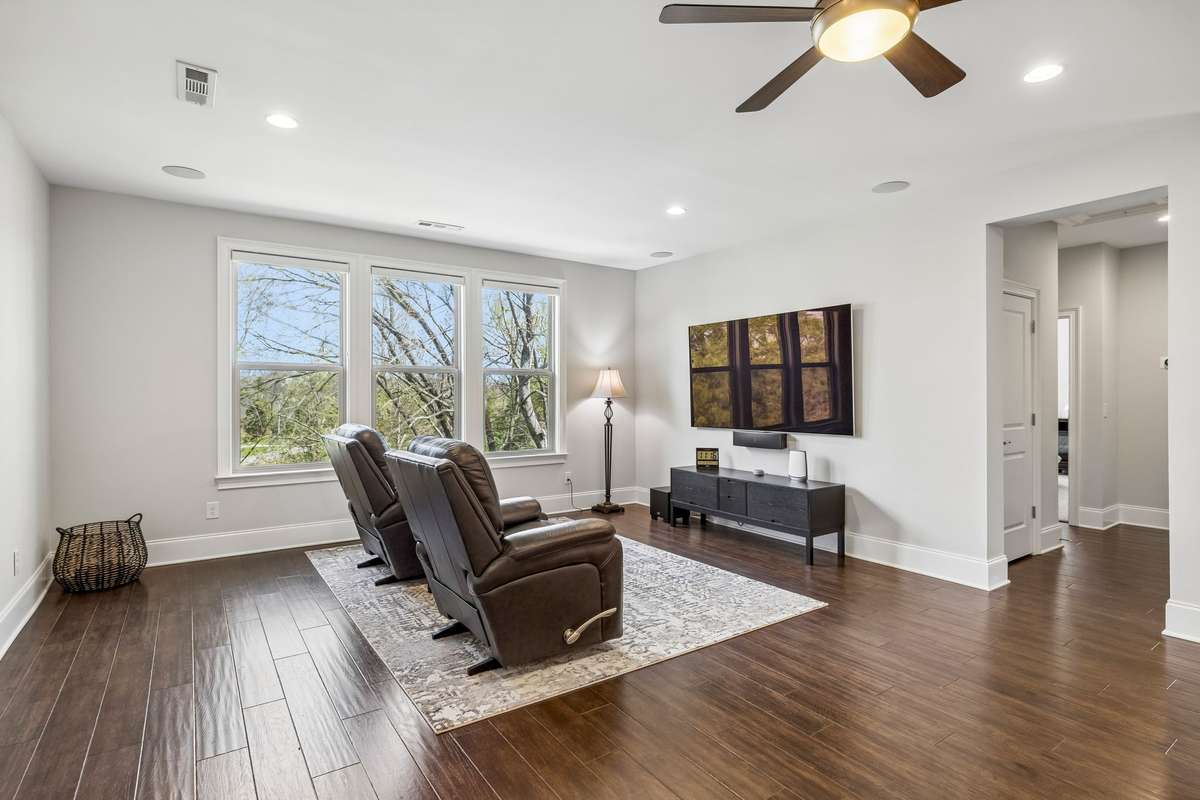 Two additional bedrooms and two full baths are located through the doorway.