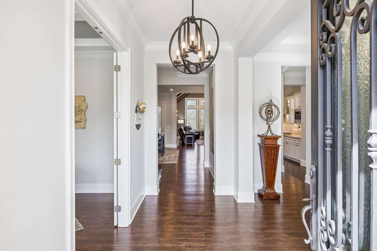 From the entry, the Office is to the left with privacy doors, and the Dining Room is to the right.