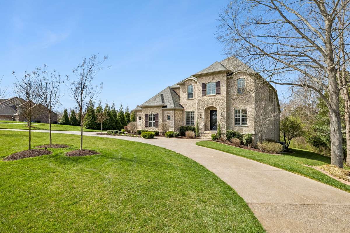 Stately home accented by beautiful landscaping and a convenient circular driveway